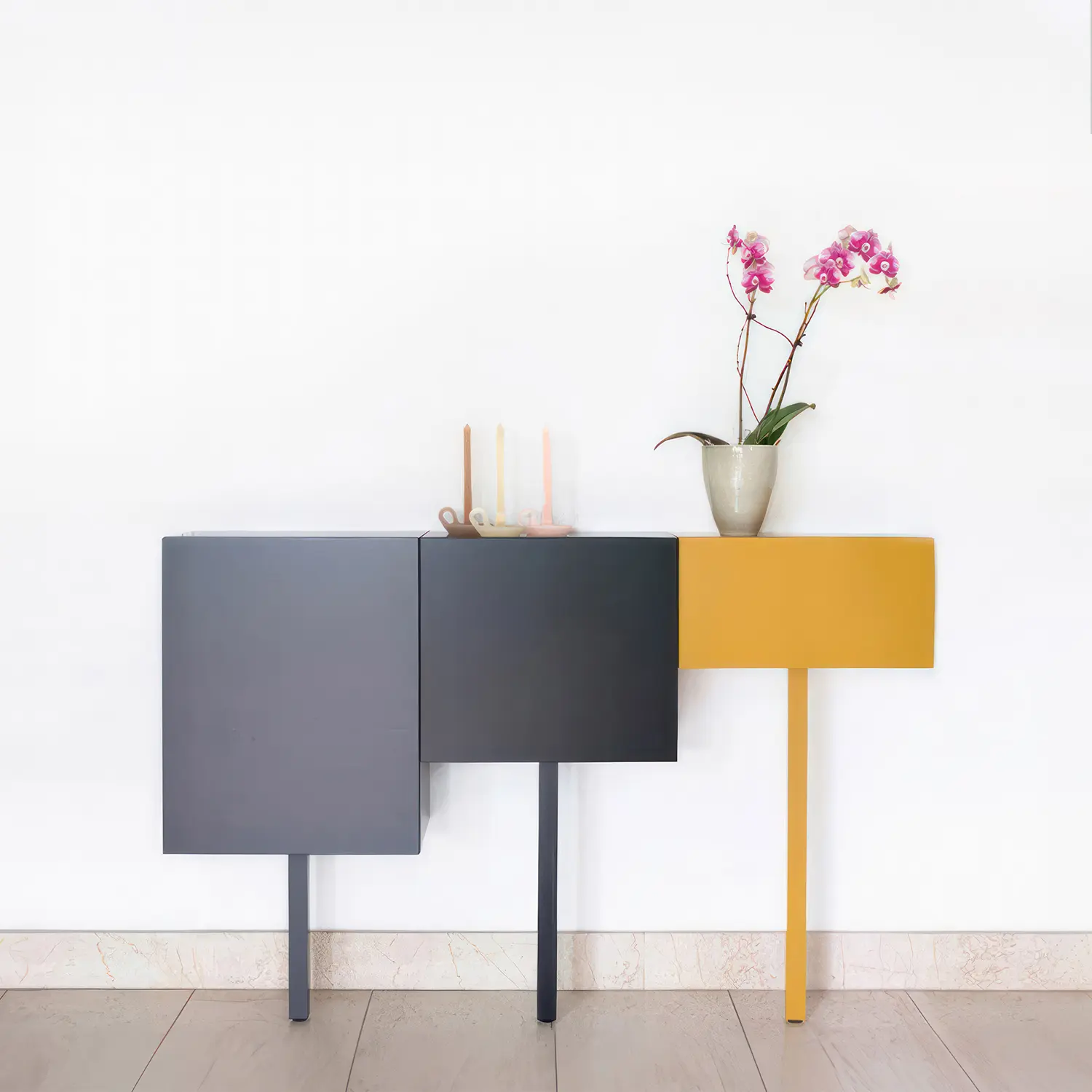 Sticks, a versatile modern cabinet system featuring small, colourful cabinets that can serve as a lowboard, sideboard, hall cabinet, or wardrobe. Produced by Castelijn.
